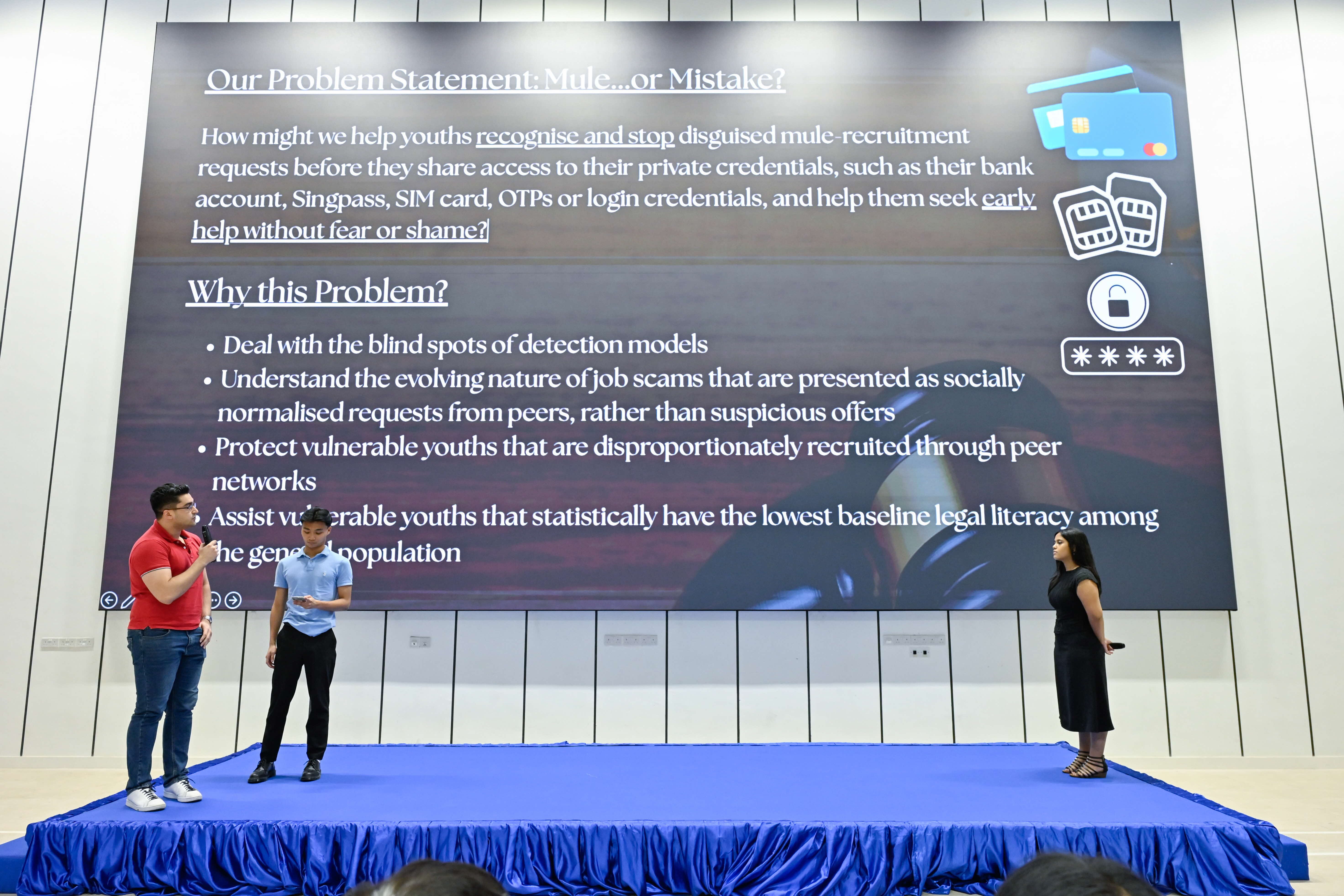 Three students explaining their problem statement